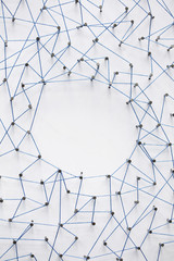 Wall Mural - A large grid of pins connected with string. Communication, technology, network concept