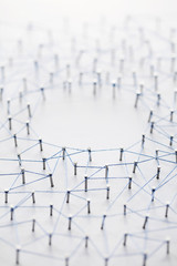 Poster - A large grid of pins connected with string. Communication, technology, network concept