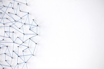 Poster - A large grid of pins connected with string. Communication, technology, network concept