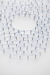 Poster - A large grid of pins connected with string. Communication, technology, network concept