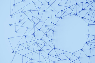 Poster - A large grid of pins connected with string. Communication, technology, network concept