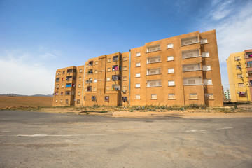 Wall Mural - Algeria - June 08, 2017: Building in a poor village in the countryside of Algeria