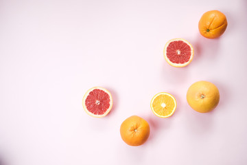 Wall Mural - Colorful fresh fruit on Gray table. Orange, banana, apples, kiwi, grapefruit. Flat lay, top view, copy space. Fruit background.