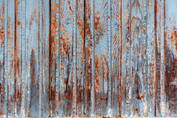 background of wooden boards with old shabby pink and blue paint