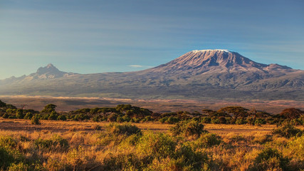 arid dry african savanna in late evening with mount kilimanjaro, highest peak i africa. amboseli nat