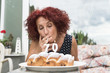 © Beatrix Boros/Stocksy - Badass senior woman smoking on a birthday cake