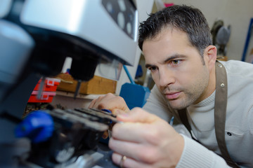 Man using key copying machine