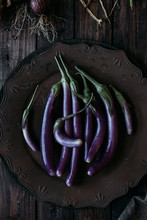 Organic Purple Eggplants On Old Fashioned Tray