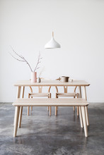 Handmade Ceramics On Wooden Table And White Lamp