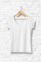 Wall Mural - Blank White Women's T-Shirt Mock-up on wooden hanger, front side view. 3D Rendering. 