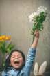 © Anna Om - Excited baby girl with flowers