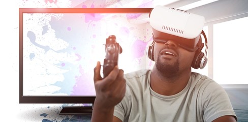 Poster - Composite image of man using virtual reality headset and playing