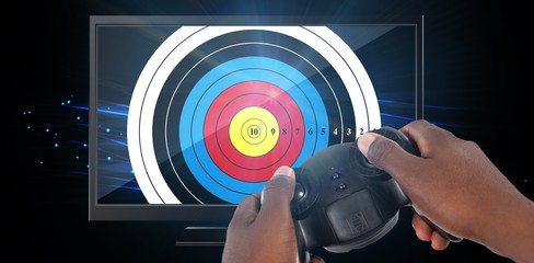 Poster - Composite image of hand of man playing video game against white