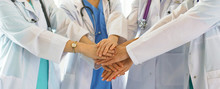 Doctors And Nurses In A Medical Team Stacking Hands