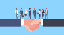 Two Businessmen Shaking Hands With Team Of Businesspeople, Business Agreement And Partnership Concept Flat Vector Illustration