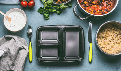 Sticker - Healthy lunch box preparation with quinoa, tomatoes beans sauce on kitchen table background with cutlery, food pots and bowls, top view