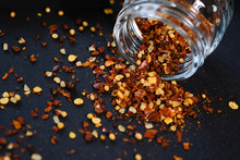 Paprika And Mustard Seeds In A Glass Jar
