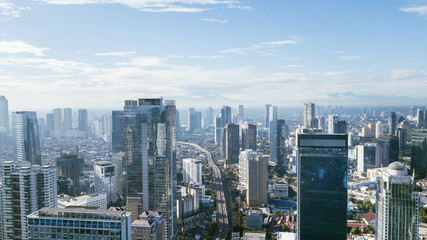  Jakarta downtown cityscape with skyscrapers and apartment buildings at sunny day