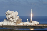 Fototapeta Kosmos - Rocket launch with moon on background. Elements of this image furnished by NASA