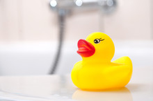 Closeup Of Yellow Rubber Duck Toy On Bath