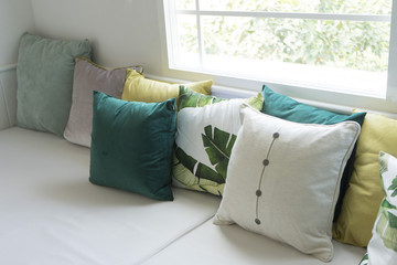 Close up of colorful pillows on sofa in modern living room