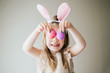 © MeganBetteridge - Little Girl Holding Easter Eggs in front of eyes