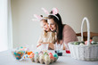© MeganBetteridge - Mother and Daughter Painting Easter Eggs together