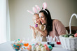 © MeganBetteridge - Mother and Daughter Painting Easter Eggs together