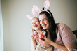© MeganBetteridge - Mother and Daughter Painting Easter Eggs together