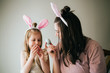 © MeganBetteridge - Mother and Daughter Painting Easter Eggs together