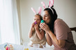 © MeganBetteridge - Mother and Daughter Painting Easter Eggs together