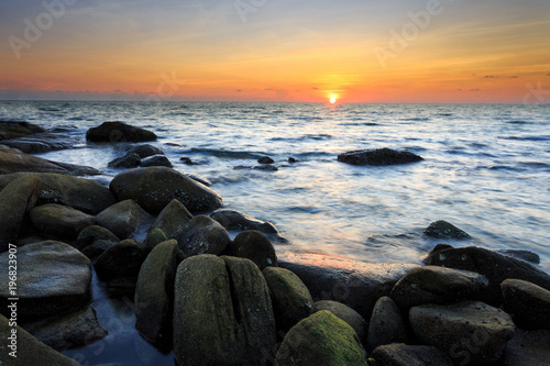 long exposure shooting of small island boat and rock in smoky and soft sea water Poster