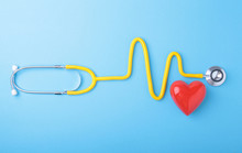 Red Heart And A Stethoscope On Blue Background