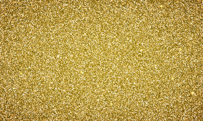 Vector gold glitter background texture banner. Magic glittery festive background for luxury gift card or holyday Christmas backdrop. Sparkle golden confetti decoration design for premium design