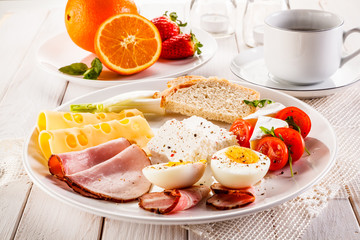 English breakfast on wooden table