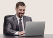 © ASDF - closeup.happy businessman working on laptop, sitting at desk