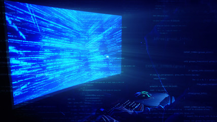 Poster - a man hacker in a hood in a dark room works with the program code