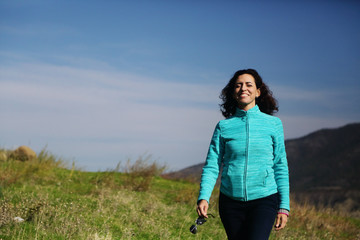 Wall Mural - Outdoor portrait of happy 40 years old woman