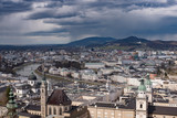 Fototapeta Miasto - Winter skyline of Salzburg at the background of high mountains Alps, view from above. Austria, Salzburg city, Europe. 