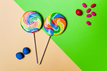 Lollipop candies on colorful background