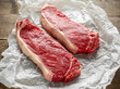 Raw premium beef sirloin steak on cooking paper