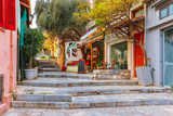 Fototapeta Uliczki - Beautiful cosy narrow street with stairs in famous Placa district, Old Town of Athens, Greece