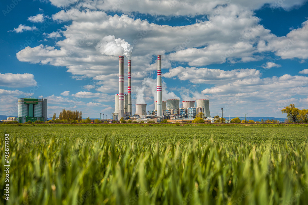 A coal-fired power station in the distance in agricultural landscape. Pocerady, Czech republic - obrazy, fototapety, plakaty 