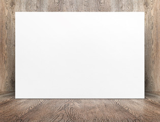 Leinwandbilder - Blank banner white paper poster leaning at wood wall on wooden floor in perspective room,Business mock up presentation.Template display of design or content