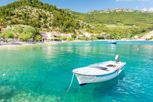 Amazing Crystal Clear Sea With Boat And Beach In Peljesac Peninsula, Dalmatia, Croatia