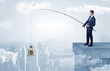 © ra2 studio - Businessman fishing currency from the city concept