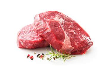 fresh raw rib eye steaks isolated on white