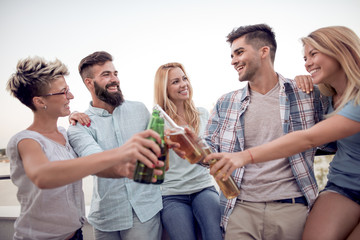 Canvas Print - Group of  friends having party on rooftop