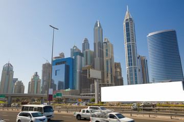 Blank billboard for advertisement at Dubai with skyline