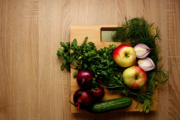 Wall Mural - Fresh vegetables and fruits on bathroom scale, lose weight concept, copy space for text or object
